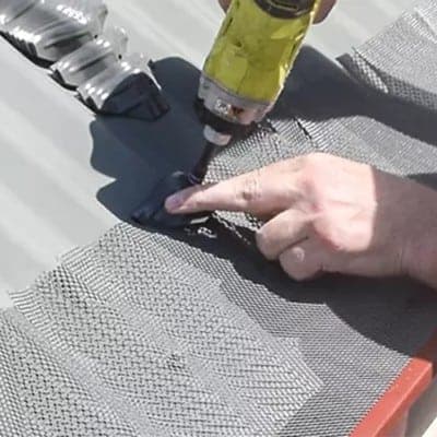 screw gutter mesh down with corrugated panels