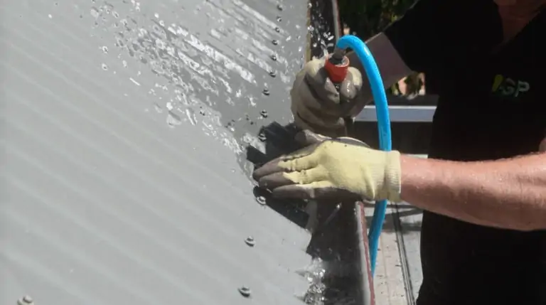 clean gutters and flush it out with hose