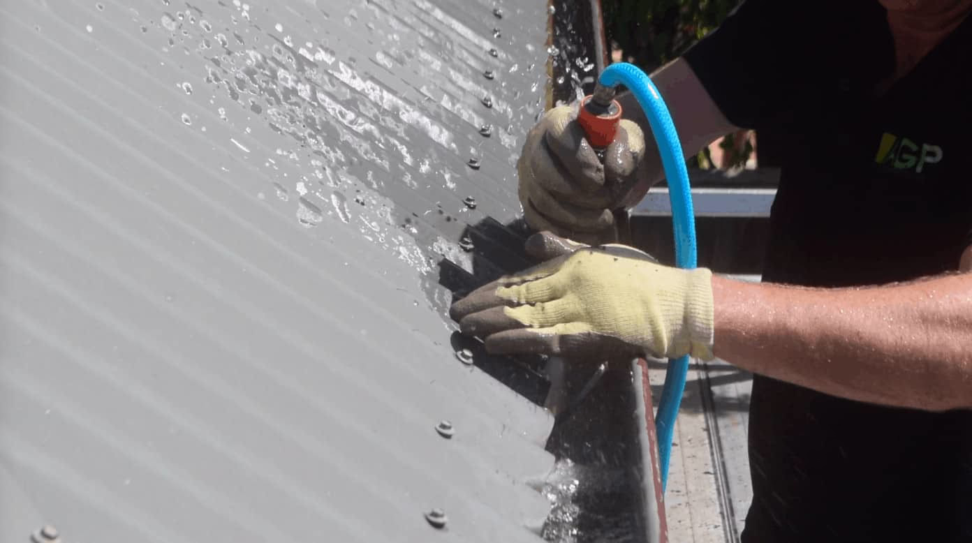 clean gutters and flush it out with hose